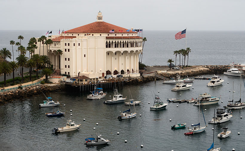 Catalina Island's historic Avalon Casino overlooking a tranquil harbor filled with boats