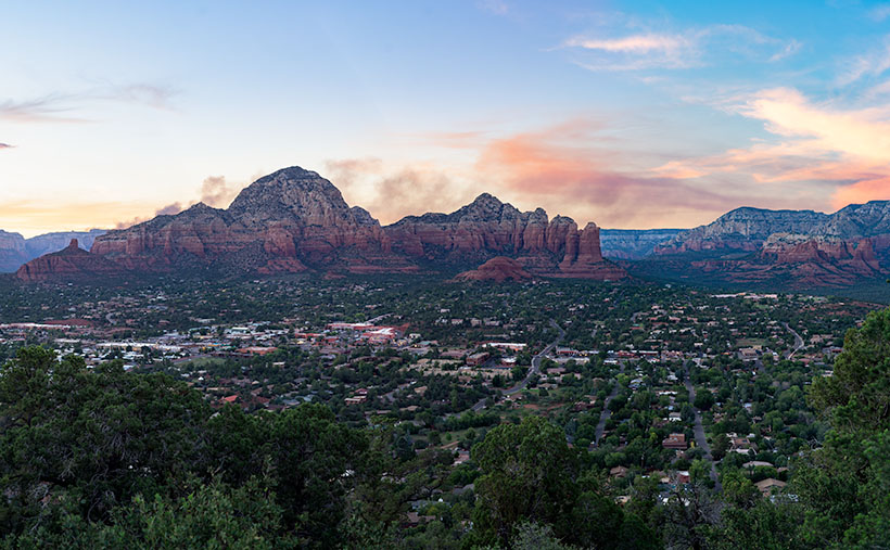 Capitol Butte sits in the middle of Sedona and on this evening there was a forest fire on the rim behind it.