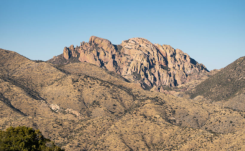 Centered view of Cochise Head, a granite formation resembling Apache Chief Cochise, in Chiricahua Mountains, Arizona.