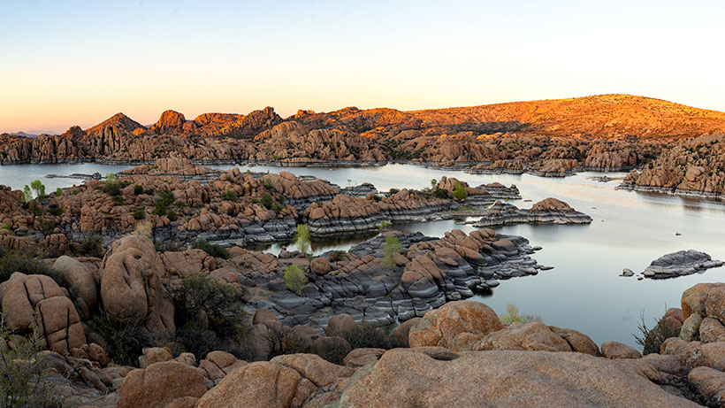 From the roadside overlook, a photograph of the Granite Dells and Watson Lake just as the sun goes down.