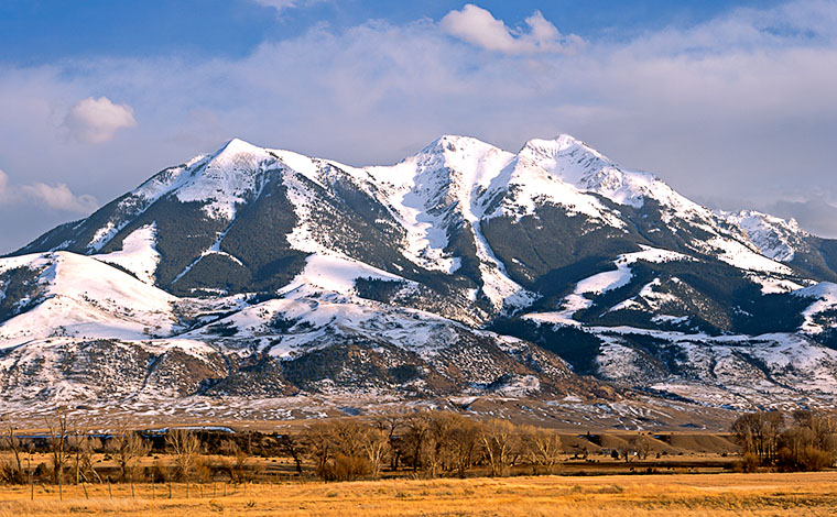 The lovely snow covered Emigrant Peak rises above Montaina's Paridise Valley north of Yellowstone. 