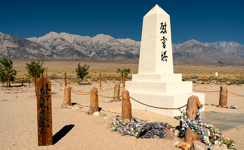 Manzanar monument under a clear blue sky with Sierra Nevada mountains in the background