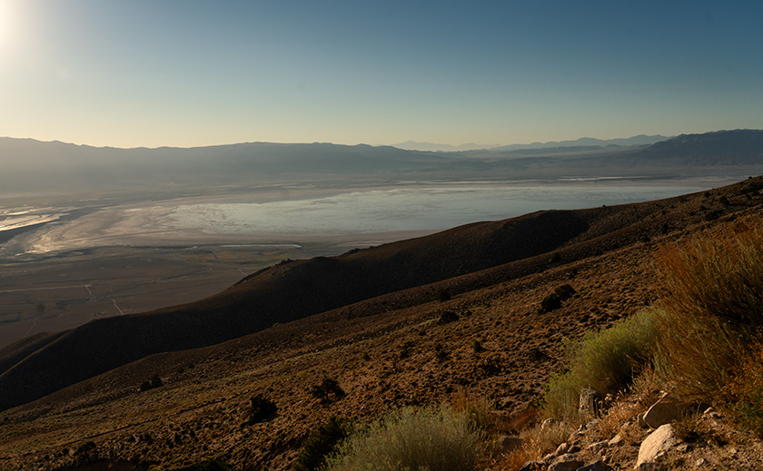 Owens Lake viewed from high on Wonogo Peak, with morning light creating an illusion of water and a shrinking shoreline visible