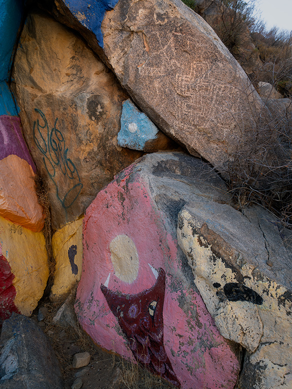 Close-up of Roy Purcell’s mural in the Cerbat Mountain foothills, painted adjacent to ancient petroglyphs, respecting historical rock art in Chloride, Arizona.