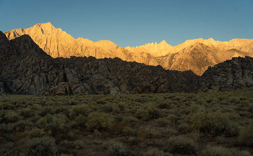 Mt. Whitney at sunrise with shadowed Alabama Hills in the foreground, paying homage to Ansel Adams