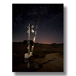 The stars shine brightly over the Piedmont rail-road crossing near Congress, Arizona.