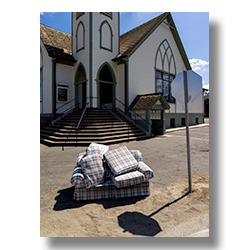 Discarded couch in front of Barksdale Church.