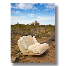 A white Lazy Boy recliner in an open Whitman field.