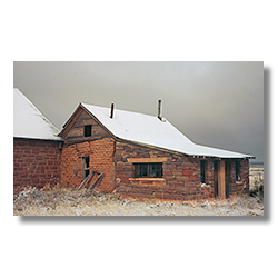 The abandoned preacher's behind the Babtist Church in Curevo New Mexico after a snowstorm.