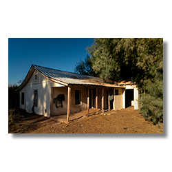 Plaster-covered adobe buildings in Agua Caliente, the former reception and guest quarters of a hot springs resort.