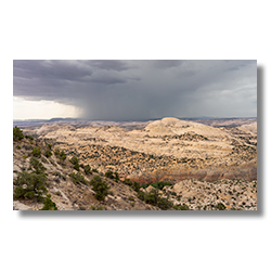 A summer thunderstorm moves across the Hogbacks near Boulder Utah.
